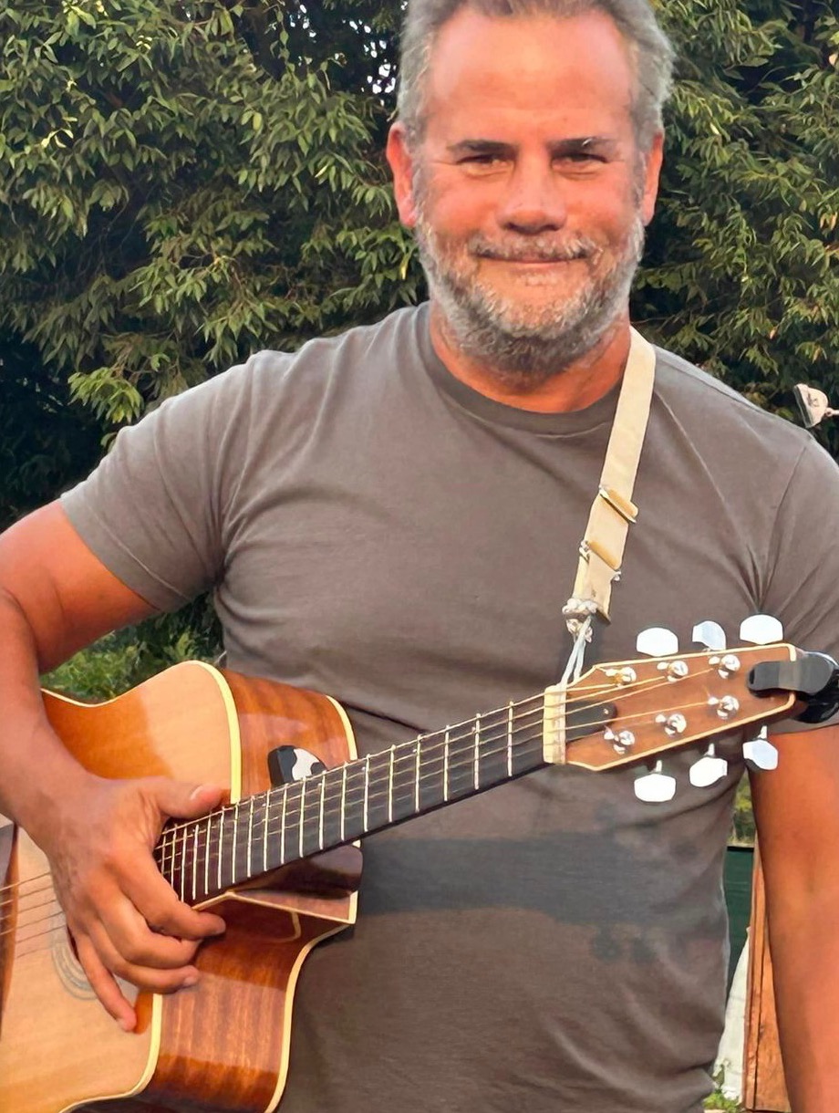 Chuck with his acoustic guitar